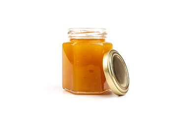 Glass jar full of sweet honey isolated on white background