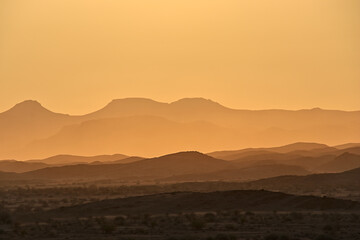 incredible view of mountains in golden light during sunset