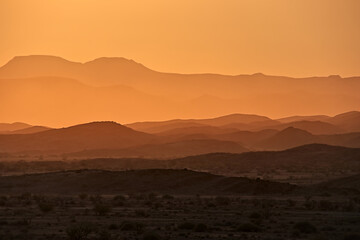incredible view of mountains in golden light during sunset