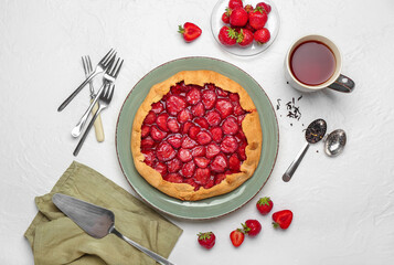 Composition with tasty strawberry pie on light background