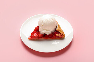 Plate of tasty strawberry pie decorated with ice cream on color background