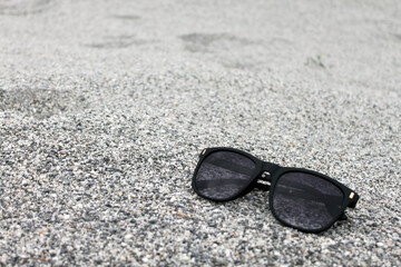 sunglass in grey desert 