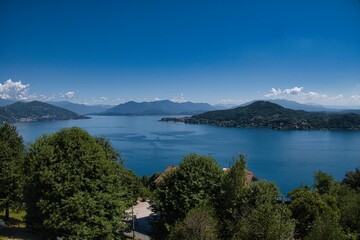 Fototapeta na wymiar landscapes of lake maggiore with its colors on a hot July day