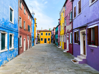 Fototapeta na wymiar Colorful houses on a small traditional square at Burano island, Venice, Italy