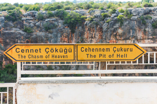 Signboard showing the famous and interesting place,  the mammoth underground Chasm of Heaven hole and The Pit of Hell in Mersin Turkey.