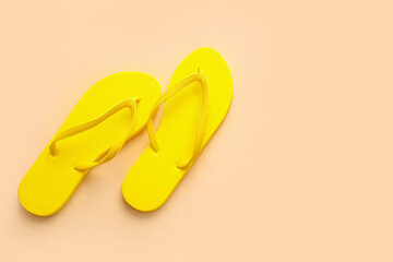 Stylish flip-flops on color background