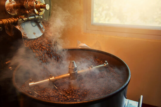 Close-up of coffee beans roasting in a coffee roaster
