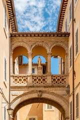 The ancient arch in Via del Seminario in the historic center of Spoleto, Italy 
