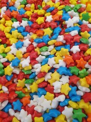 Lots of bright and tasty sweets.  The candies are made in the shape of stars and painted in a variety of rich colors.