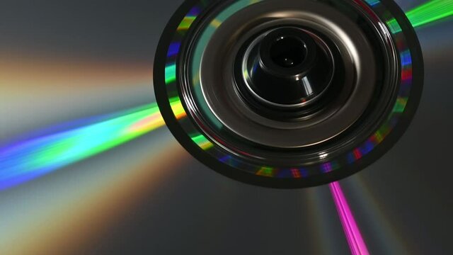 DVD disk rotating gleaming colorful rainbow