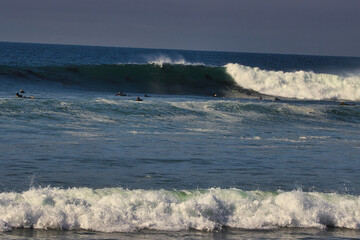 Surfing big summer waves at Leo Carrillo state beach