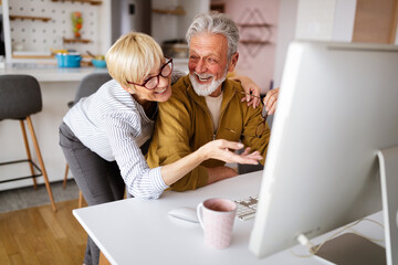 Senior retired couple learn about computer and online support. - Powered by Adobe
