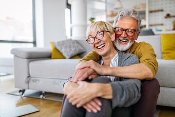 Happy senior couple in love hugging and bonding with true emotions