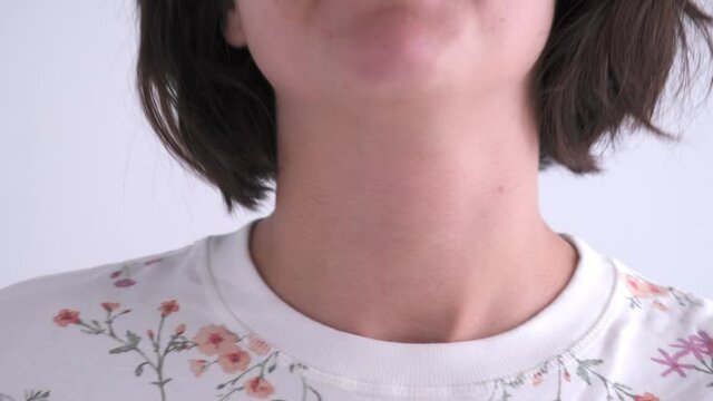 Caucasian Female Putting On and Putting Off Orthopedic Cervical Neck Collar