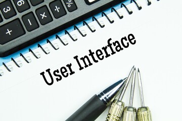 calculator, notebook, pen, arrows with words user interface