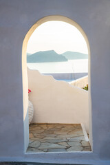 traditional Greek door opening to the sea