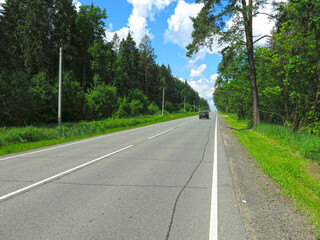 Fototapeta na wymiar deserted asphalt highway in summer