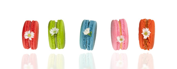 Colorful macaroons on white background.  Food levitation concepts.