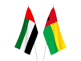 National fabric flags of United Arab Emirates and Republic of Guinea Bissau isolated on white background. 3d rendering illustration.
