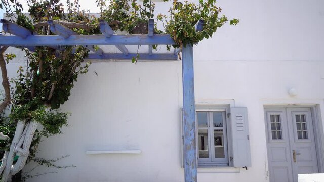 greek island house with pergola grape arbor tile patio