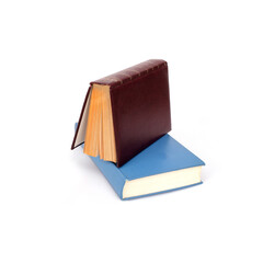 Stack of books in colour covers with white sheets isolated on a white background