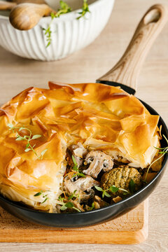 Vegan falafel with mushrooms topped with flaky and crispy filo dough lid