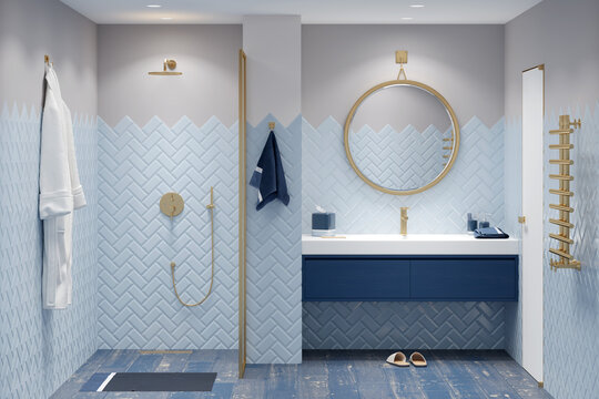 A modern bathroom in blue tones with gold fittings, a bathrobe next to the shower, a round mirror over a large washbasin with a blue cabinet, a golden heated towel rail next to a white door. 3d render