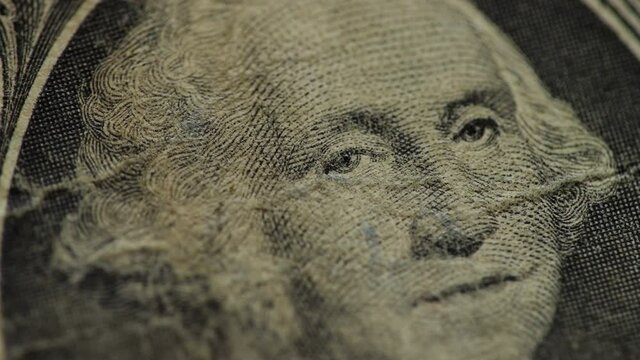 Old dollar bancnote close up. One dollar moving. Stylish business background. Dilapidated bill.