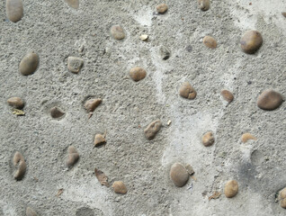 Fototapeta na wymiar Stone in cement walkway. Cement background.