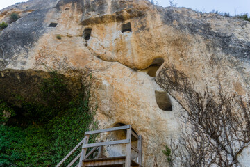 Small caves dug in ancient times in a mountain, to store the wheat crop. Today it is a tourist attraction in Alfafara, Alicante (Spain). 