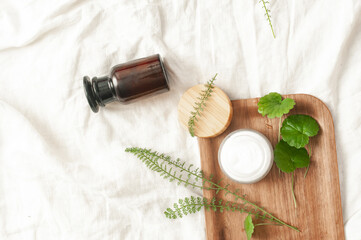 Sustainability concept cosmetic background brown glass veil with product flat lay green natural beauty bblog concept