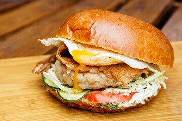 juicy burger with filling, cheese, meat