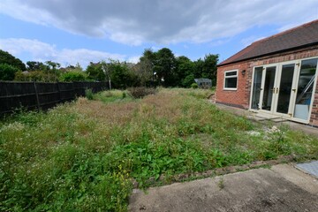 A neglected garden at an empty house in the uk.