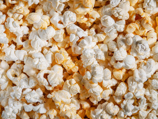 Delicious background of freshly made popcorn. From above. Horizontal