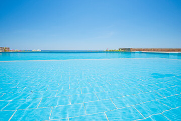 Fototapeta na wymiar Outdoor swimming pool in a luxury tropical hotel resort