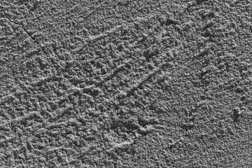 black and white background with a crack, the texture of a plastered wall