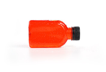 Fresh pomegranate juice packed in a small plastic bottle on white background. Tea in plastic bottle, Cold green tea, fruit juice