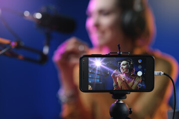 Young woman streaming a live video
