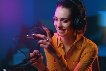 Young radio presenter working at the radio broadcasting station