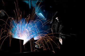 Fototapeta na wymiar Production operation electric welding with beautiful sparks