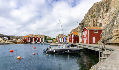 Smögen, Sweden - June 9, 2021: View on the half ob bay with typically fishing cottages on old...