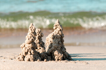 Photo of sand castle on the beach background