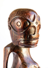 traditional wooden Polynesian tiki from Marquesas Islands. White background