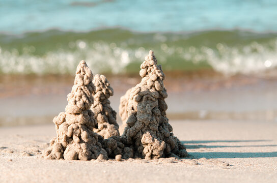Photo of sand castle on the beach background