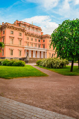 Obraz premium The beautiful facade of the Mikhailovsky Castle in the city center in summer. A tourist attraction. Saint Petersburg, Russia - 11 June 2021