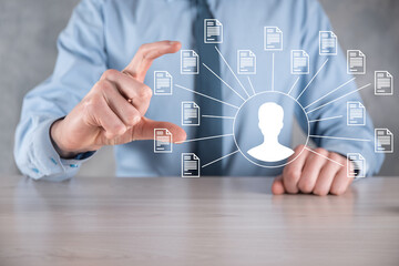 Document Management System DMS .Businessman hold user and document icon.Software for archiving,...