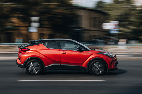 Ukraine, Kyiv - 16 July 2021: Red Toyota C-HR car moving on the street. Editorial