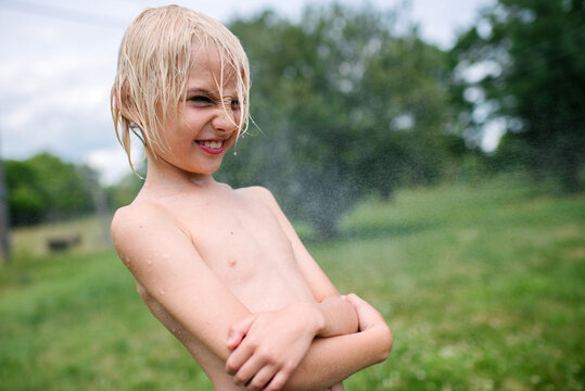 Canada, Ontario, Kingston, Wet shirtless boy (8-9)