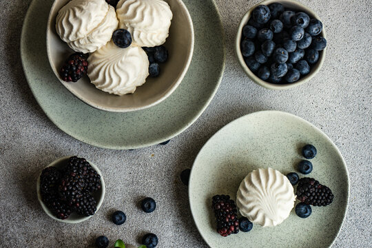Zefir dessert with blueberries and blackberries on a table