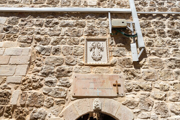 The coat of arms carved from stone over the entrance to the Sandanai Monastery in Christian quarters in the old city of Jerusalem, Israel